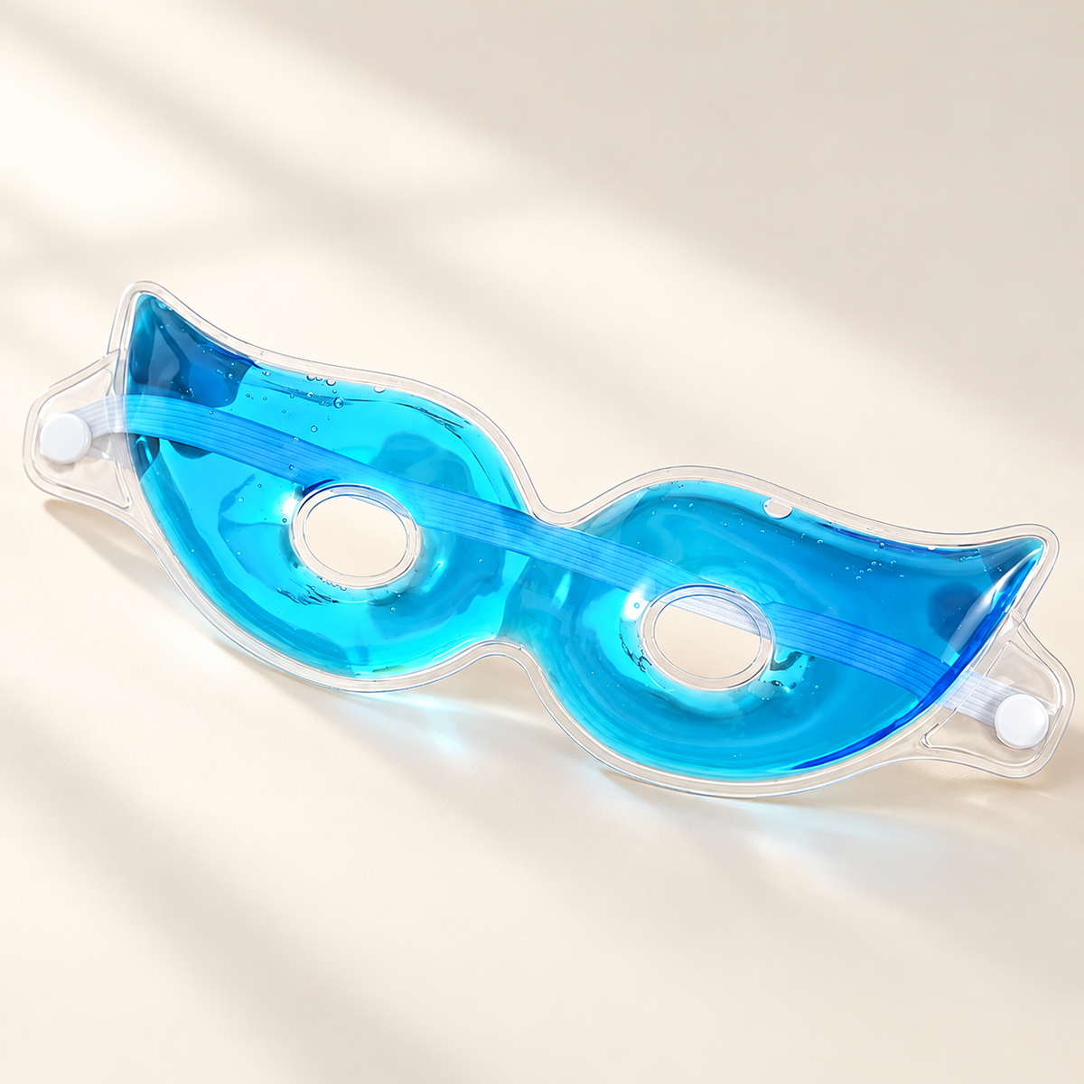 Reusable Cooling Gel Eye Mask on a warm ivory studio background